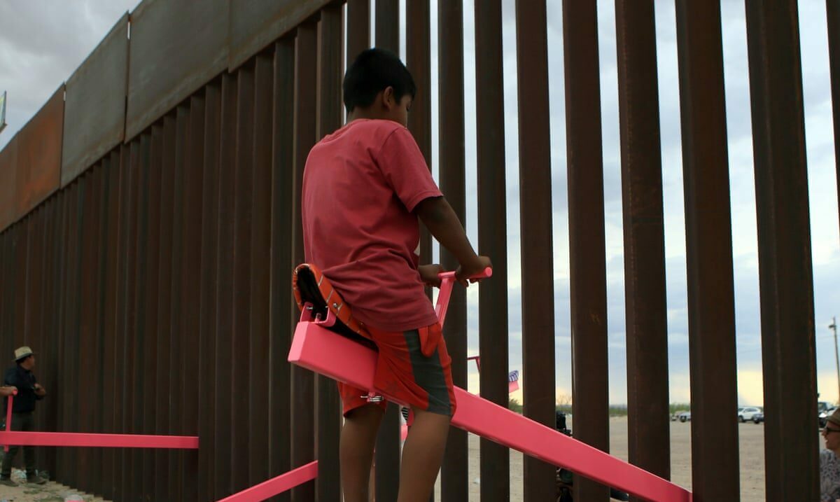 American and Mexican families enjoying the Teeter Totter Wall, which crosses the Mexican border with US, in 2019. Photograph: Luis Torres/AFP/Getty Images