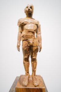 «Fragmented man»2020 Elm wood and golden leaf. 48x14x12 cm.